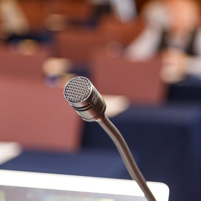 microphone-over-conference-hall-background-2021-08-26-17-11-18-utc (1) microphone-over-conference-hall-background-2021-08-26-17-11-18-utc (1)